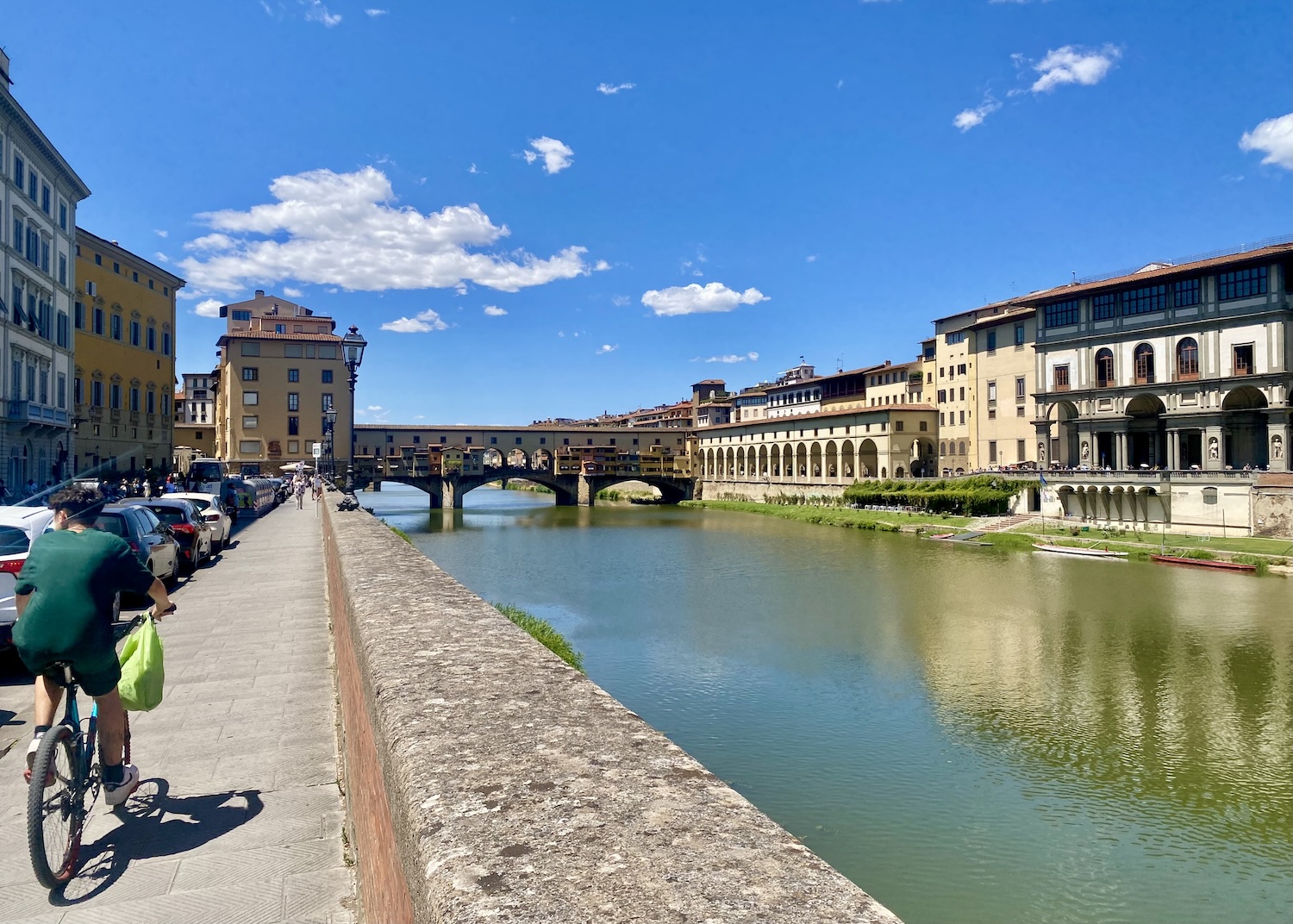 Cycling along the Arno River in Florence, Italy